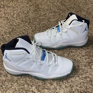Size 6.5y White and blue Retro 11 Jordan’s. Gently worn